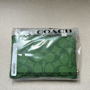 Coach Signature zip wristlet